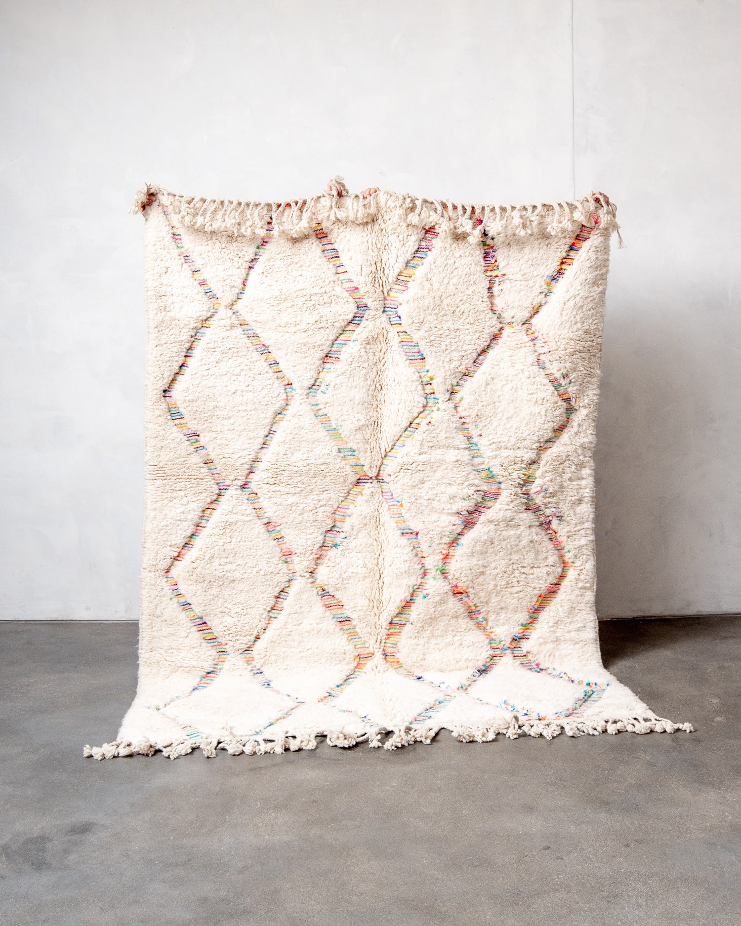 Modern, designer, handcrafted Berber rug from Morocco. Beniourain carpet with beautiful colours and patterns and fluffy wool texture.